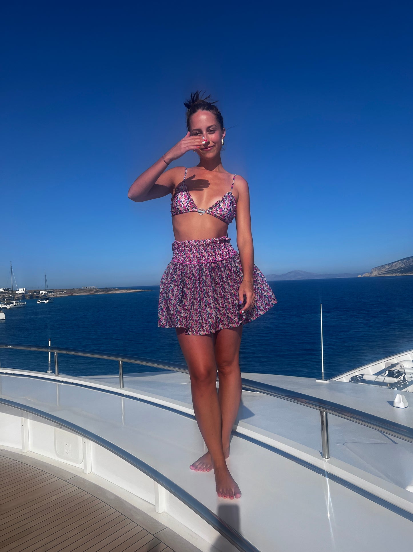 The Naxos Scrunch Dress is a stunning strapless mini dress that features a dreamy mix of purple, pink, and blue floral patterns. Designed with a flattering scrunch tube top, it accentuates your figure while providing comfort. The breezy flared skirt adds a playful touch, making this dress versatile for any occasion, from beach outings to casual gatherings. Effortlessly stylish, this dress combines elegance with ease, ensuring you look chic and feel fabulous all summer long!