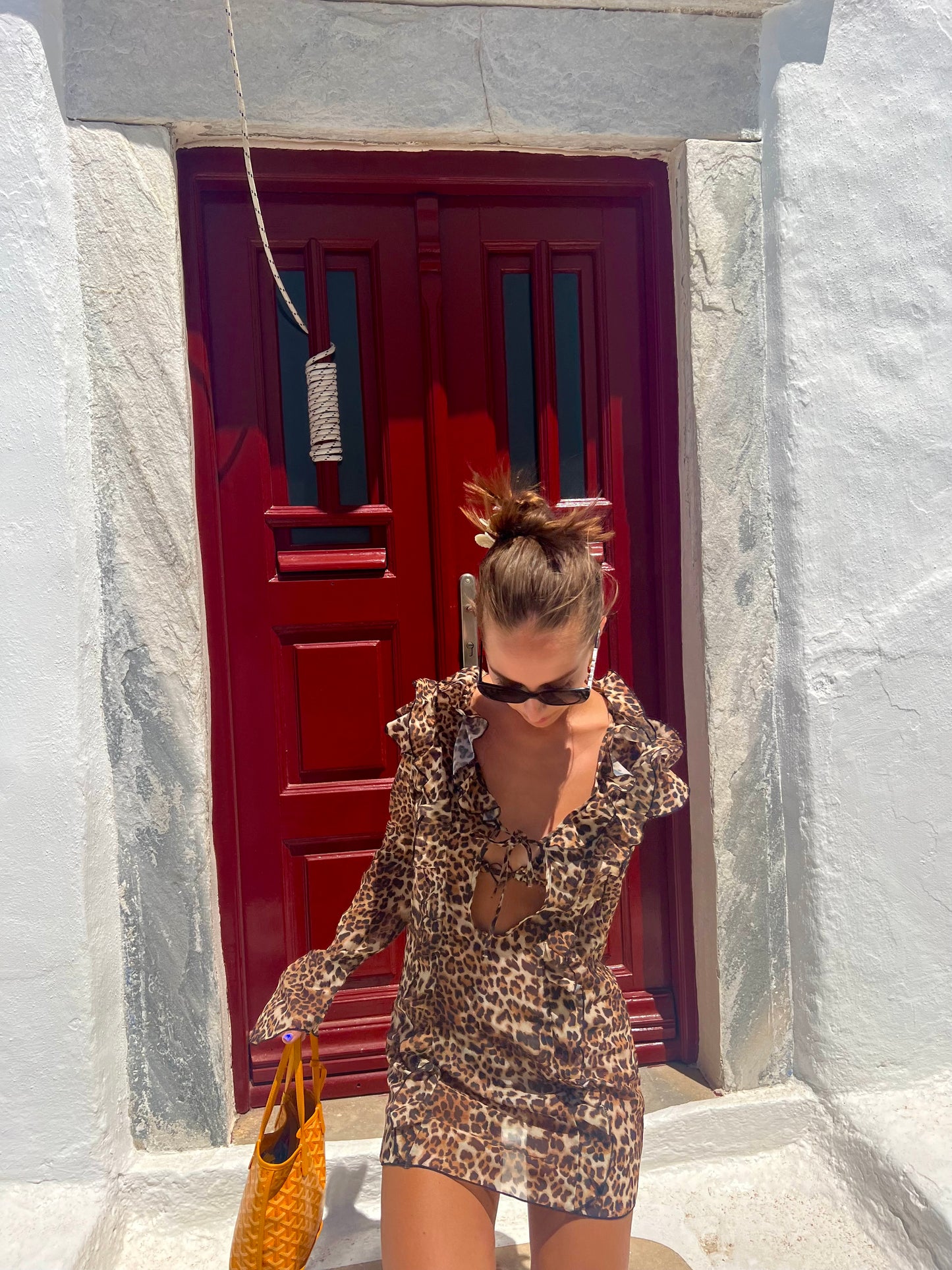 Make a bold statement with the Kit Kat Chiffon Dress, featuring a playful leopard print that exudes fierce femininity. The ruffled neckline adds a flirty touch, while the lightweight fabric ensures versatility as a stylish cover-up or a standout statement dress. Perfect for beach outings or casual gatherings, this dress combines wild charm with effortless elegance. Embrace your playful side and let the Kit Kat Chiffon Dress elevate your wardrobe with its vibrant personality and chic design!