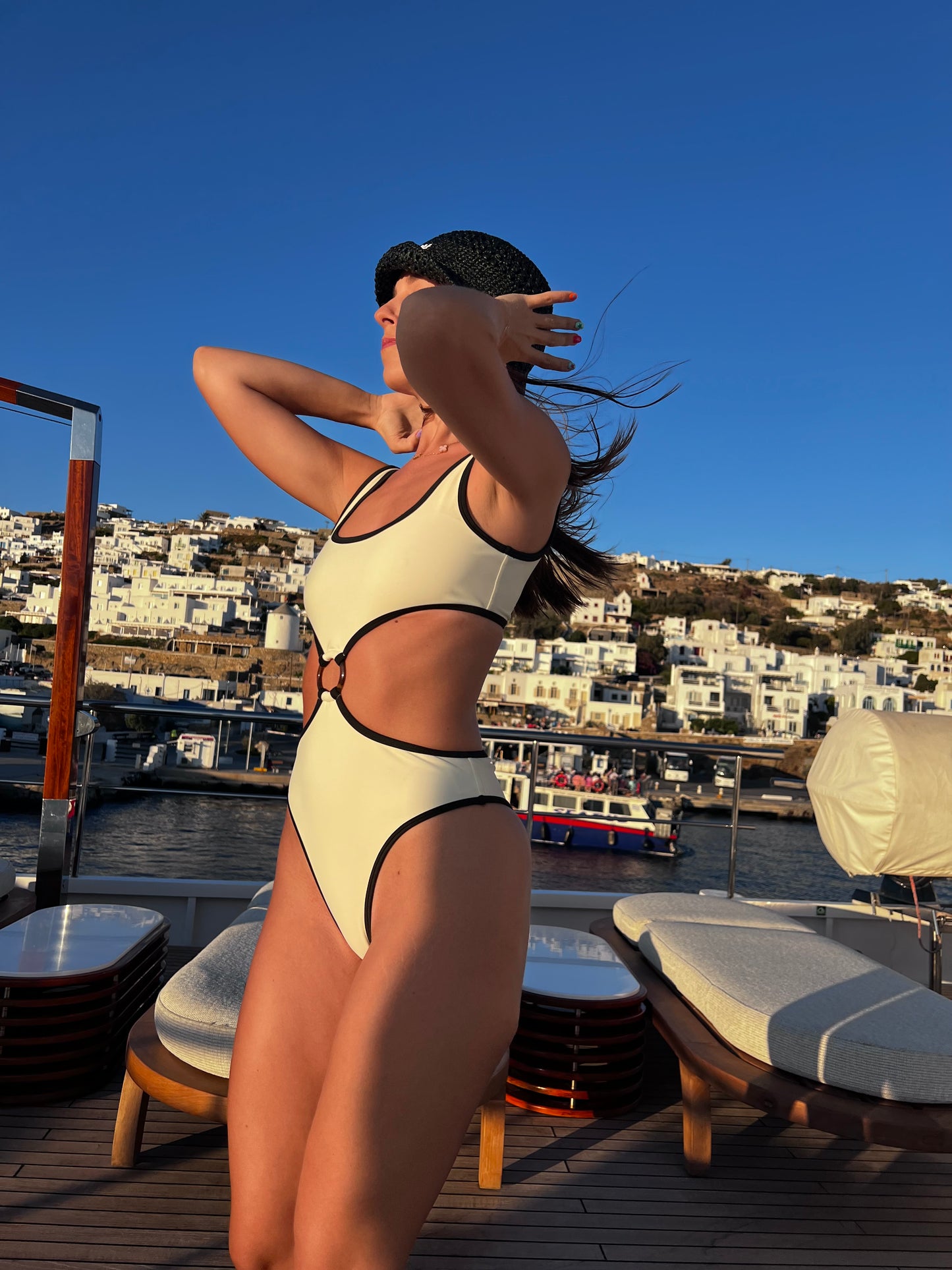 The Pepper & Salt One Piece, a sophisticated swimwear choice that embodies modern elegance. This classy design features a timeless monochrome palette of cream and black, beautifully complemented by a chic brown ring detail. Its modest cut ensures comfort while maintaining a stylish silhouette, making it perfect for any beach or poolside occasion. With its blend of sophistication and contemporary flair, The Pepper & Salt One Piece is an essential addition to your summer wardrobe!