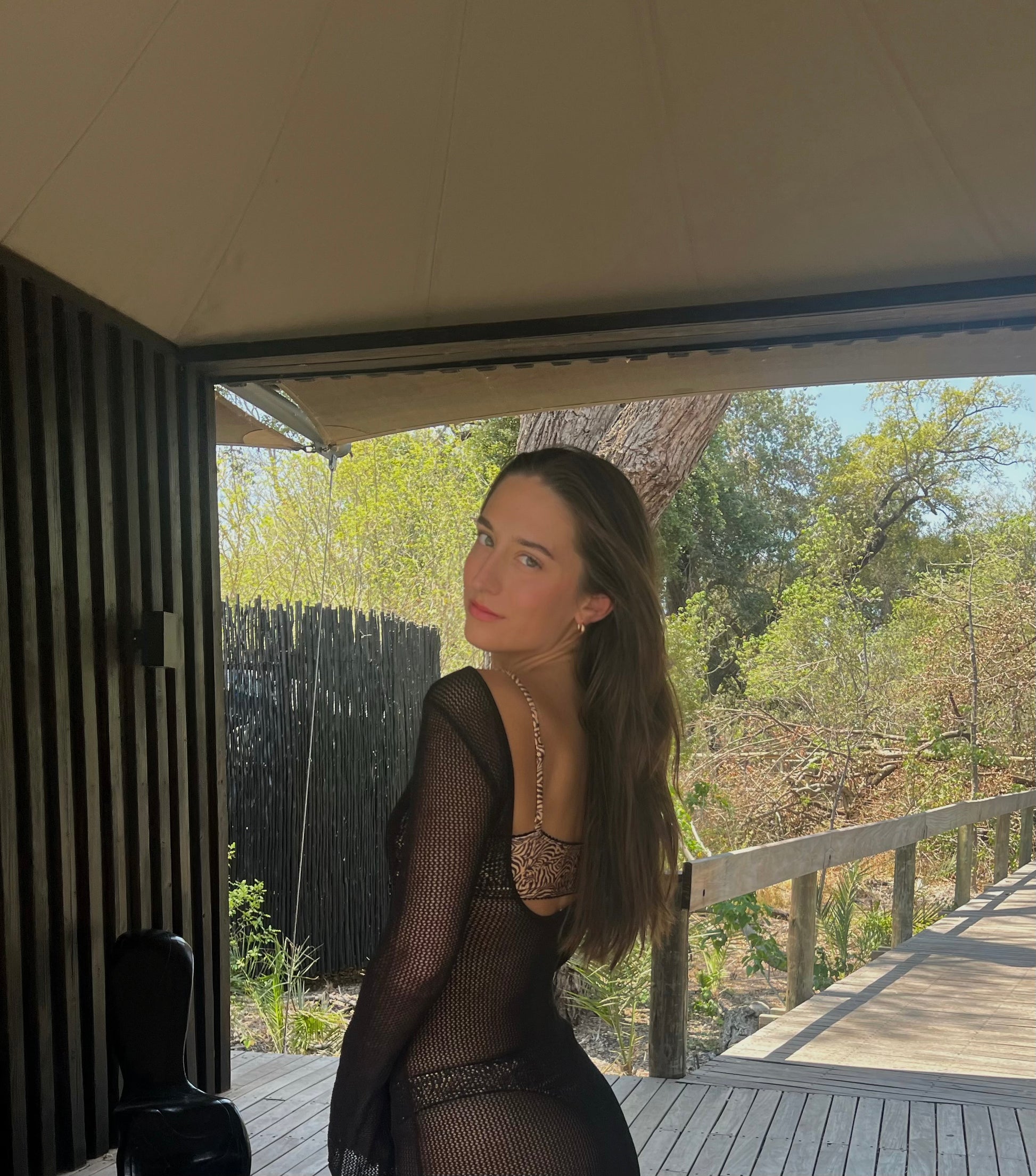 The Desert Lily Dress, an elegant black knit bikini cover-up that effortlessly combines style and comfort. This maxi dress features a thin, breathable mesh that gracefully molds to your body, accentuating your silhouette. With long sleeves for added sophistication, it provides a perfect balance of grace and confidence. Ideal for beach outings or casual gatherings, The Desert Lily Dress is designed to elevate your summer wardrobe while ensuring you feel chic and comfortable all day long!