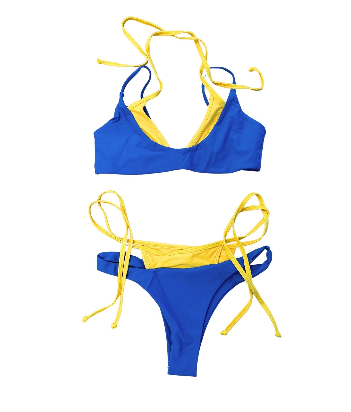 The Demetra Bikini, a unique double-layered style that offers a fun 2-in-1 design. Featuring a vibrant combination of blue and yellow, this bikini makes a bold statement with its eye-catching colors. Perfect for those who love to stand out, the Demetra Bikini is both stylish and playful, embodying the spirit of summer. Its comfortable fit ensures you can enjoy beach days or pool parties with confidence. Elevate your swimwear collection with this fun and colorful piece!