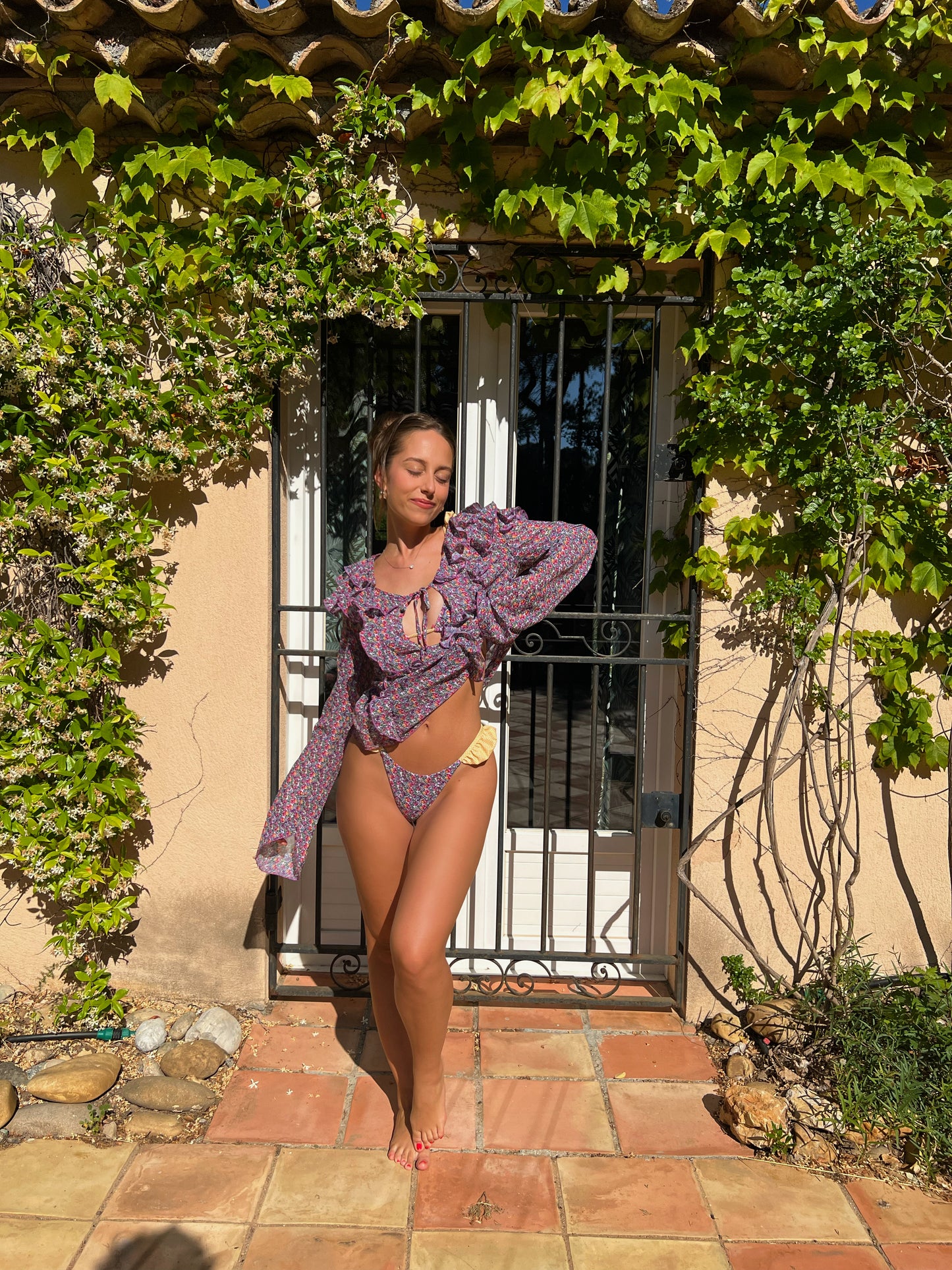 The Saint Tropez Chiffon Dress, a dreamy mini dress that effortlessly combines style and comfort. With its playful purple and pink floral print, this dress exudes a chic, feminine vibe. The flattering neckline and ruffle detail enhance its flowy silhouette, making it perfect for any occasion. Crafted from lightweight, breezy fabric, it offers a stunning look while keeping you cool and comfortable. Embrace effortless elegance this summer with The Saint Tropez Chiffon Dress, your go-to for sunny days!