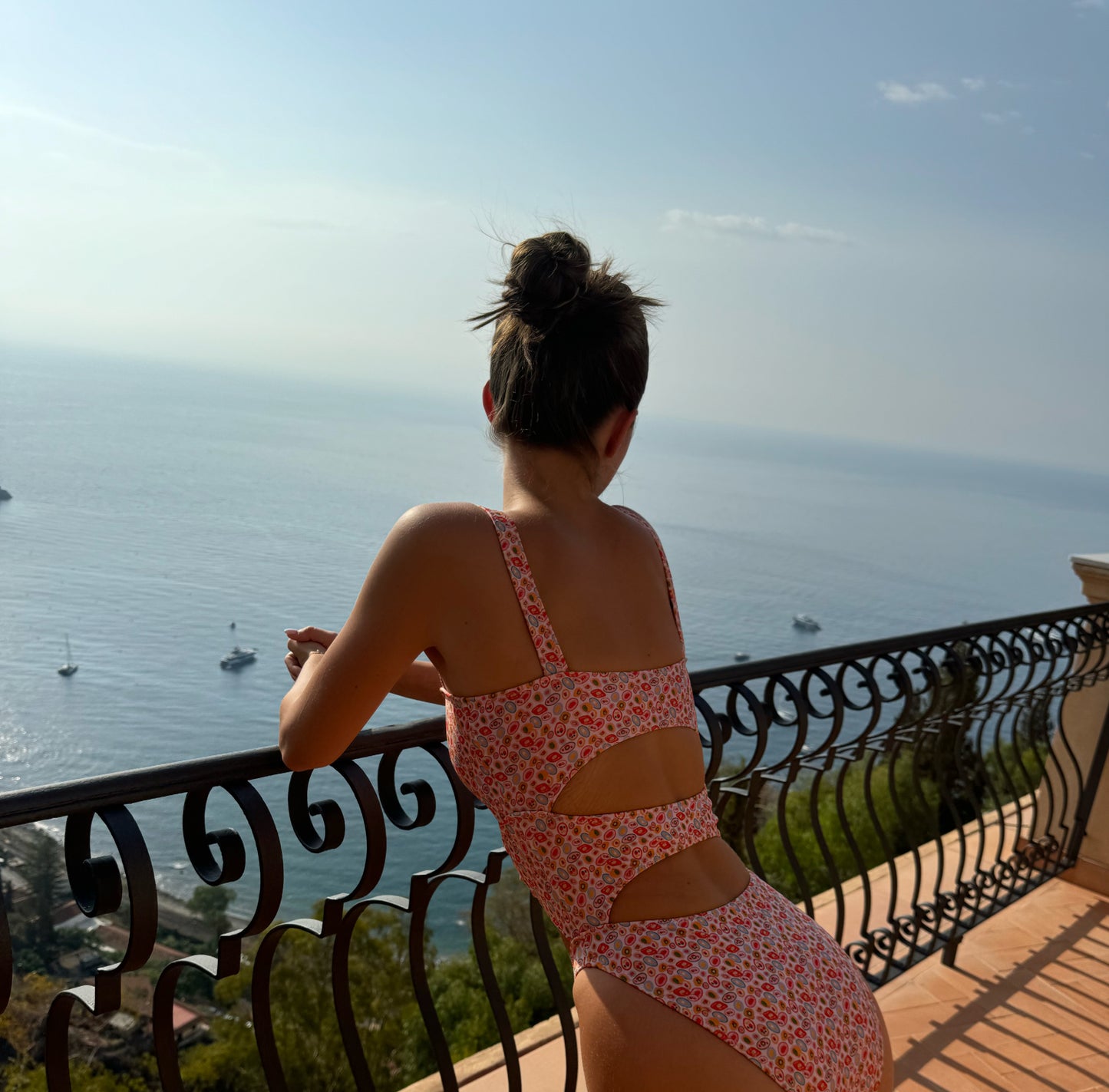 The Merlot One Piece Swimsuit, a refreshing and glamorous choice for your swimwear collection. Featuring a juicy orange abstract bubble print, this swimsuit showcases a sculpting multi-tier silhouette that accentuates your curves beautifully. Designed for support and style, it offers a secure fit that ensures you feel confident while making a statement. With its unforgettable design, The Merlot One Piece is perfect for those seeking a lively yet elegant look that stands out at the beach or pool!