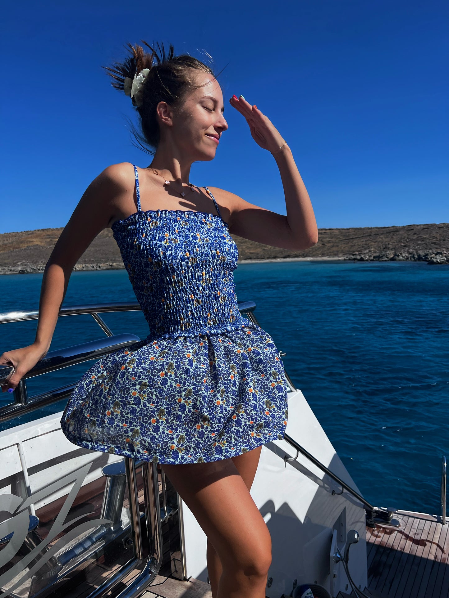 The Mykonos Scrunch Dress is a vibrant and versatile tube dress that captures the essence of Greek summer. Adorned with beautiful blue, white, and pops of yellow florals, this dress is perfect as a stylish cover-up or a chic outfit for sunny adventures. The soft scrunched material hugs your curves beautifully, while the lightweight, flowy skirt ensures comfort and movement. Embrace effortless elegance with this must-have piece that’s ideal for beach days and casual outings alike!