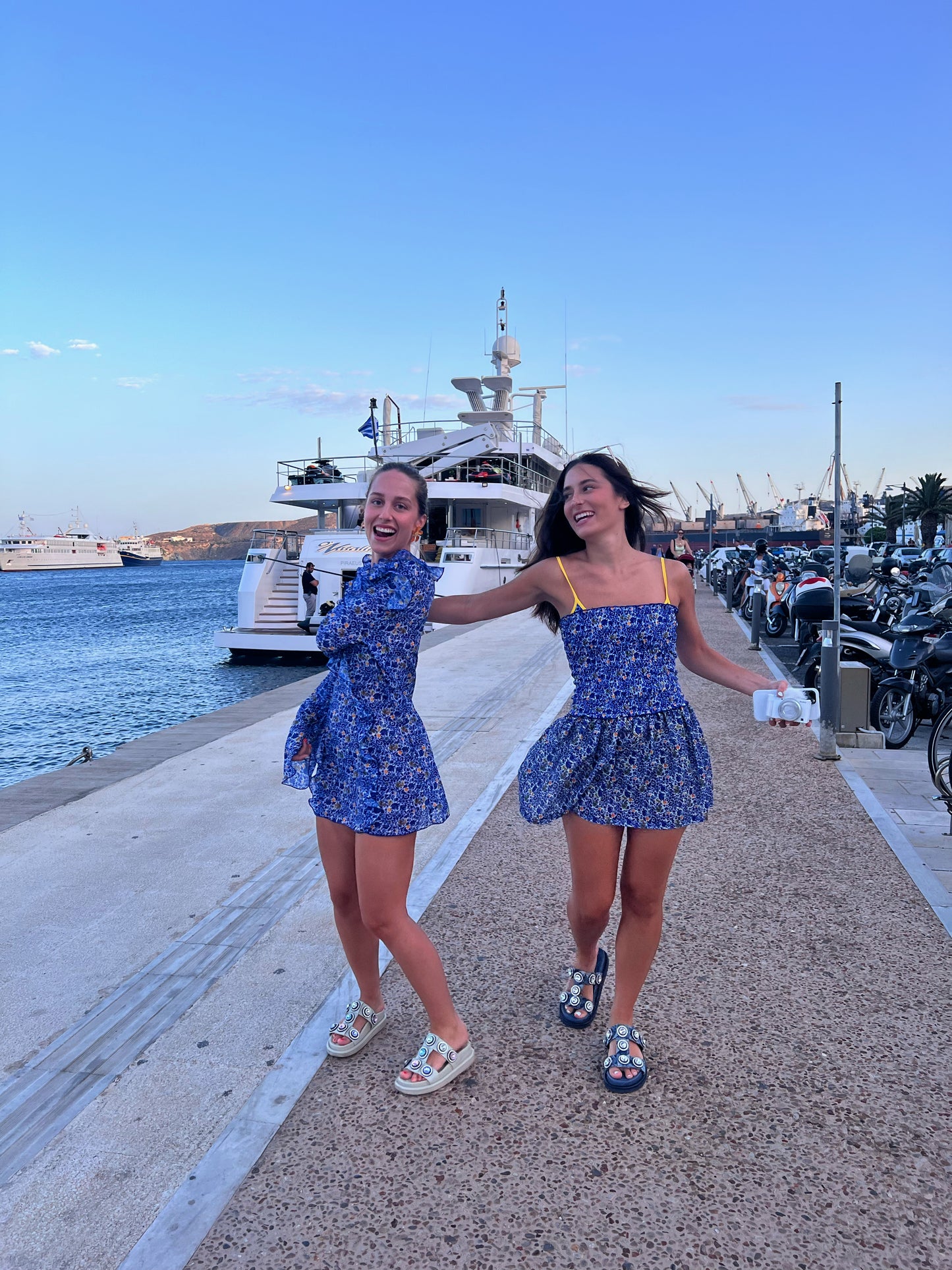 The Mykonos Chiffon Dress is the ultimate chic cover-up, perfect for sunny days. This breezy floral mini dress features a stunning blue and white pattern with vibrant sunny yellow highlights that evoke the beauty of Greece. The elegant ruffle front and delicate string tie add a touch of sophistication, while its lightweight fabric ensures you stay cool and comfy. Embrace effortless style and elegance with this must-have dress for your summer wardrobe!