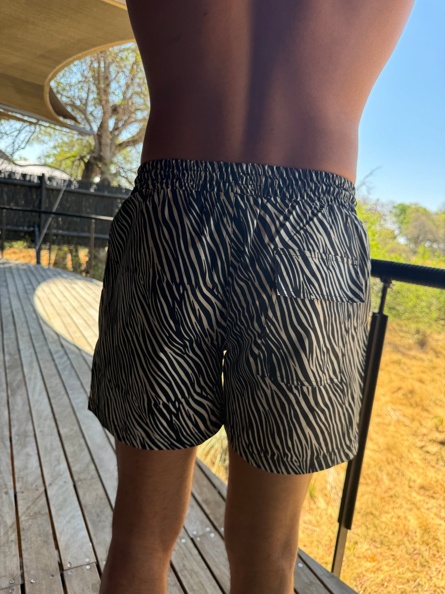 The Carbon Copy Short, the ultimate statement trunks for men that combine comfort with bold style. Featuring an eye-catching zebra print, these swim shorts are impossible to miss and perfect for making a splash. Crafted from versatile sport material, they ensure a secure fit whether you're hitting the beach or lounging by the pool. Embrace your wild side with The Carbon Copy Short, designed for those who want to stand out while enjoying maximum comfort this summer!