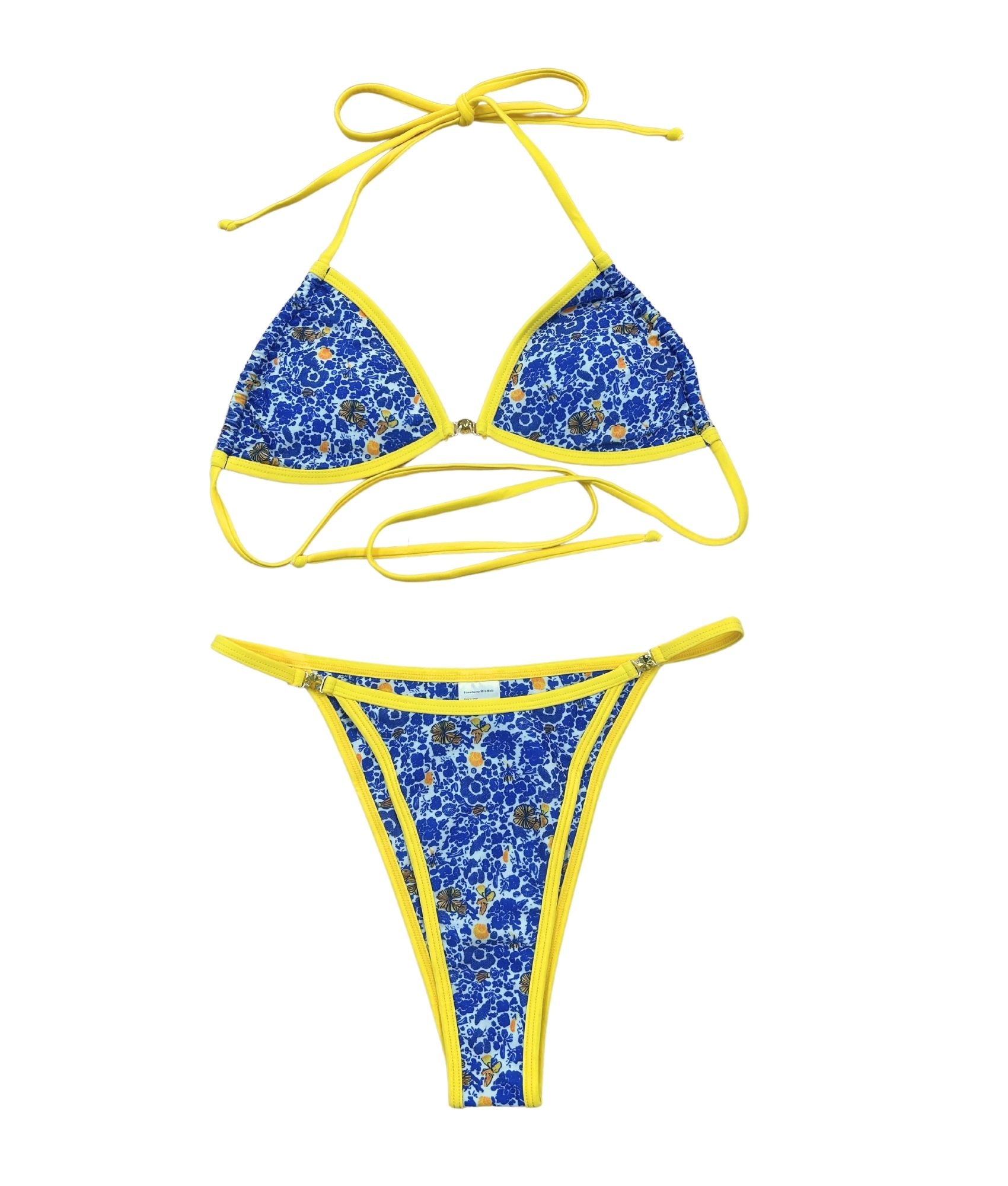 The Ophelia Bikini, a stunning statement piece that radiates vibrant energy. Featuring a classic blend of Mediterranean blue, vibrant yellow, and crisp white, this bikini is adorned with a bold floral print that evokes the beauty of Greece. The eye-catching yellow gemstone accents and matching straps add a touch of elegance. With its flattering fit and stylish design, this bikini is perfect for making a splash at the beach or pool this summer!