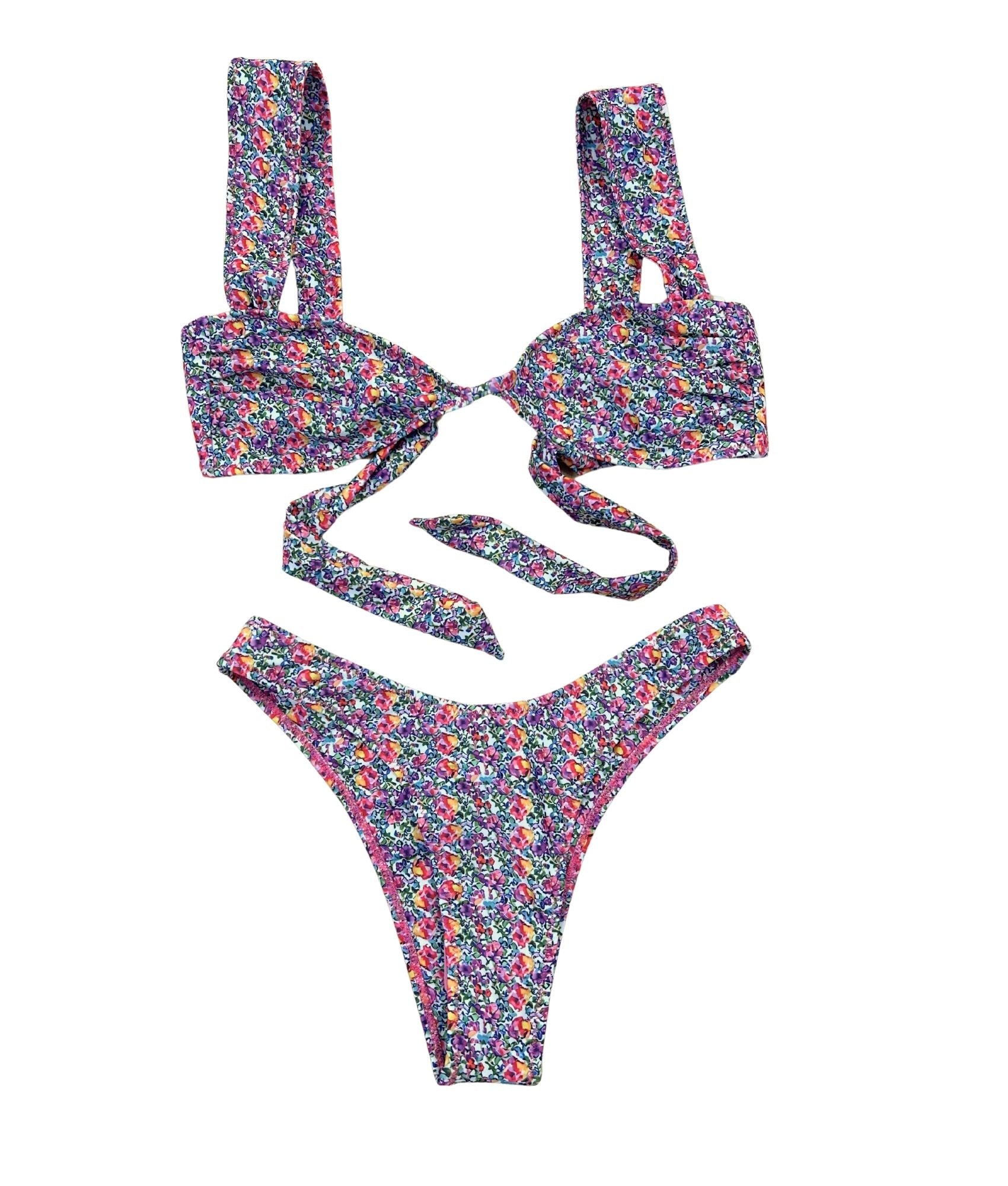 The Primrose Bikini, a delightful blend of comfort and style that captures the essence of summer. Adorned with dreamy pink and purple florals on a crisp white base, this bikini is both girly and flattering. Its cute design ensures you feel confident and comfortable, whether you're lounging by the pool or enjoying a beach day. With its charming aesthetic and flattering fit, The Primrose Bikini is the perfect choice for those who want to make a stylish splash this season!