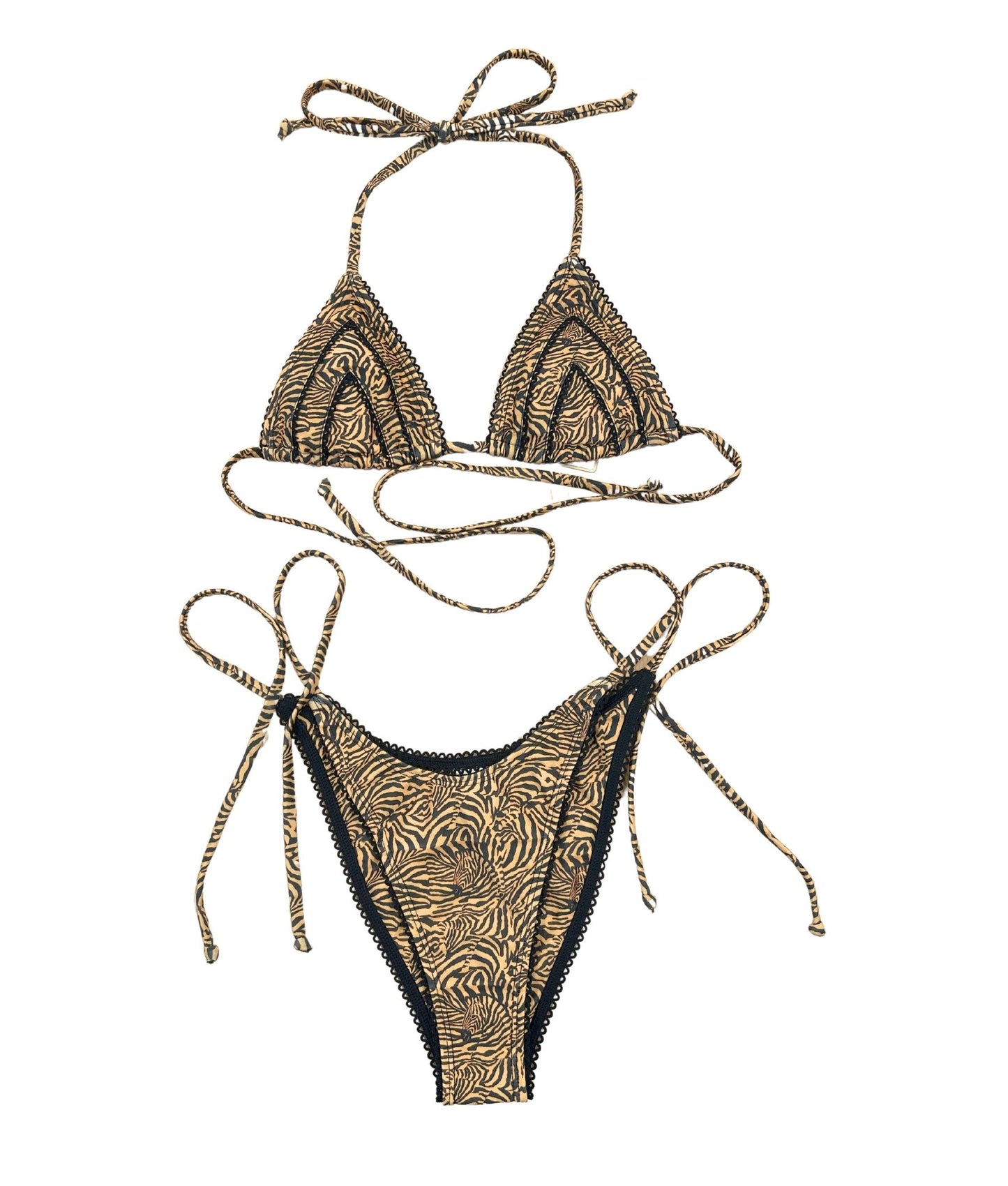 The Feline Bikini, a stunning swimwear piece featuring a bold bronze tiger-striped design that exudes wild charm. Accented with sleek black lace detailing, this bikini elevates your beach style while offering versatility for any summer occasion. Its flattering cut ensures you feel confident and chic, making it perfect for lounging by the pool or enjoying a day at the beach!