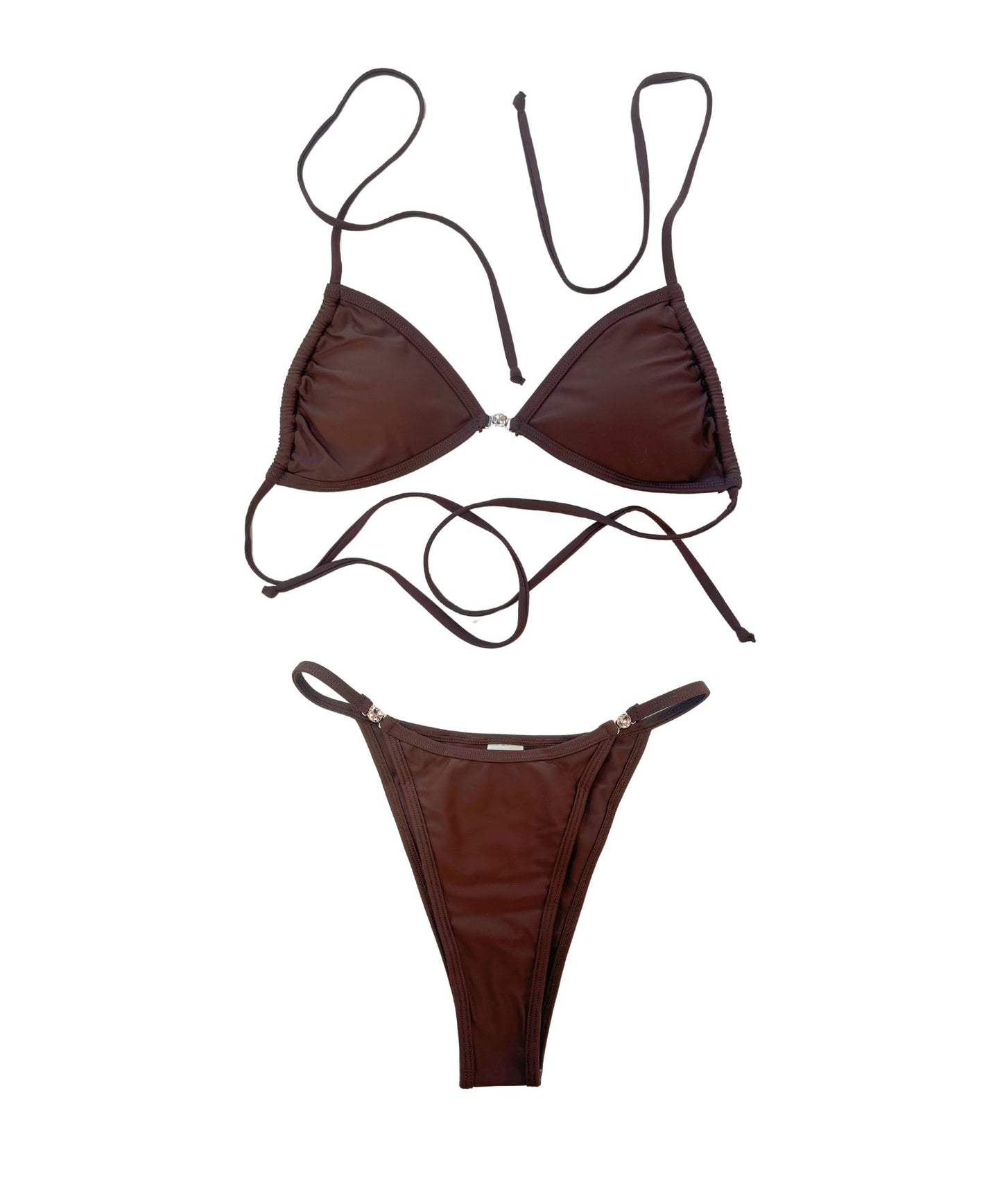 The luxurious Juno Bikini, featuring a rich chocolate brown hue accented with sparkling pink gem details for a touch of glamour. This sleek, minimalist design embodies effortless elegance, making it the perfect treat for sun-soaked days. The flattering cut ensures you feel confident and chic, whether lounging by the pool or enjoying a beach getaway. Elevate your swimwear collection with this deliciously stylish bikini that combines comfort and sophistication seamlessly!