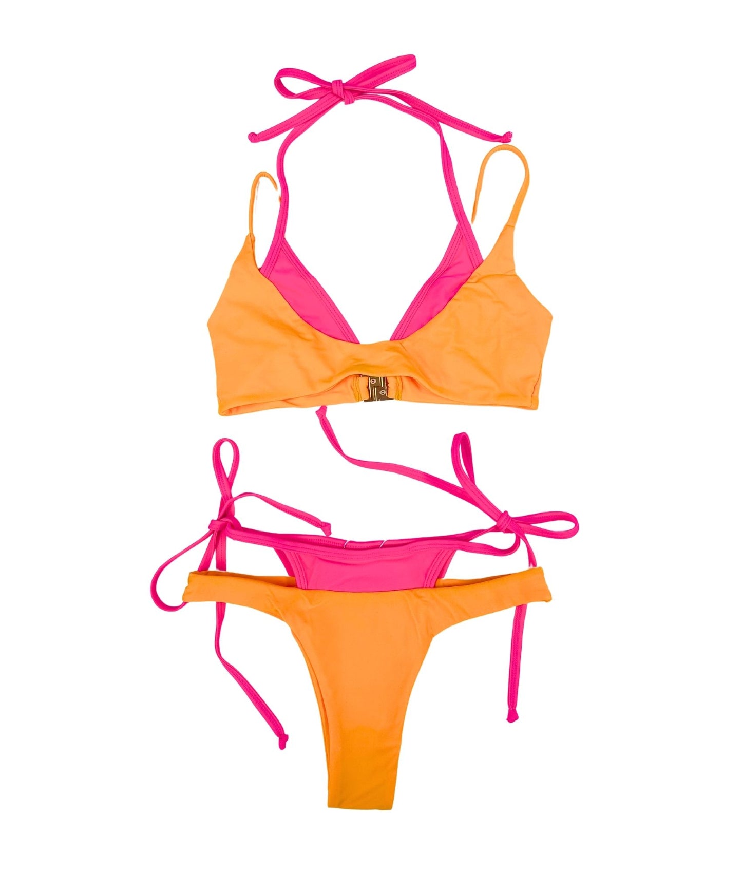 The Paros Bikini, a striking swimwear piece designed for those who love to stand out. Featuring a double-layer effect, this bikini showcases a vibrant combination of hot pink and bold orange, ensuring you make an eye-catching statement. Its sporty and natural fit flatters all body types, providing comfort and confidence whether you're lounging by the pool or hitting the beach. With its bold colors and flattering design, The Paros Bikini is your go-to choice for a fun summer look!