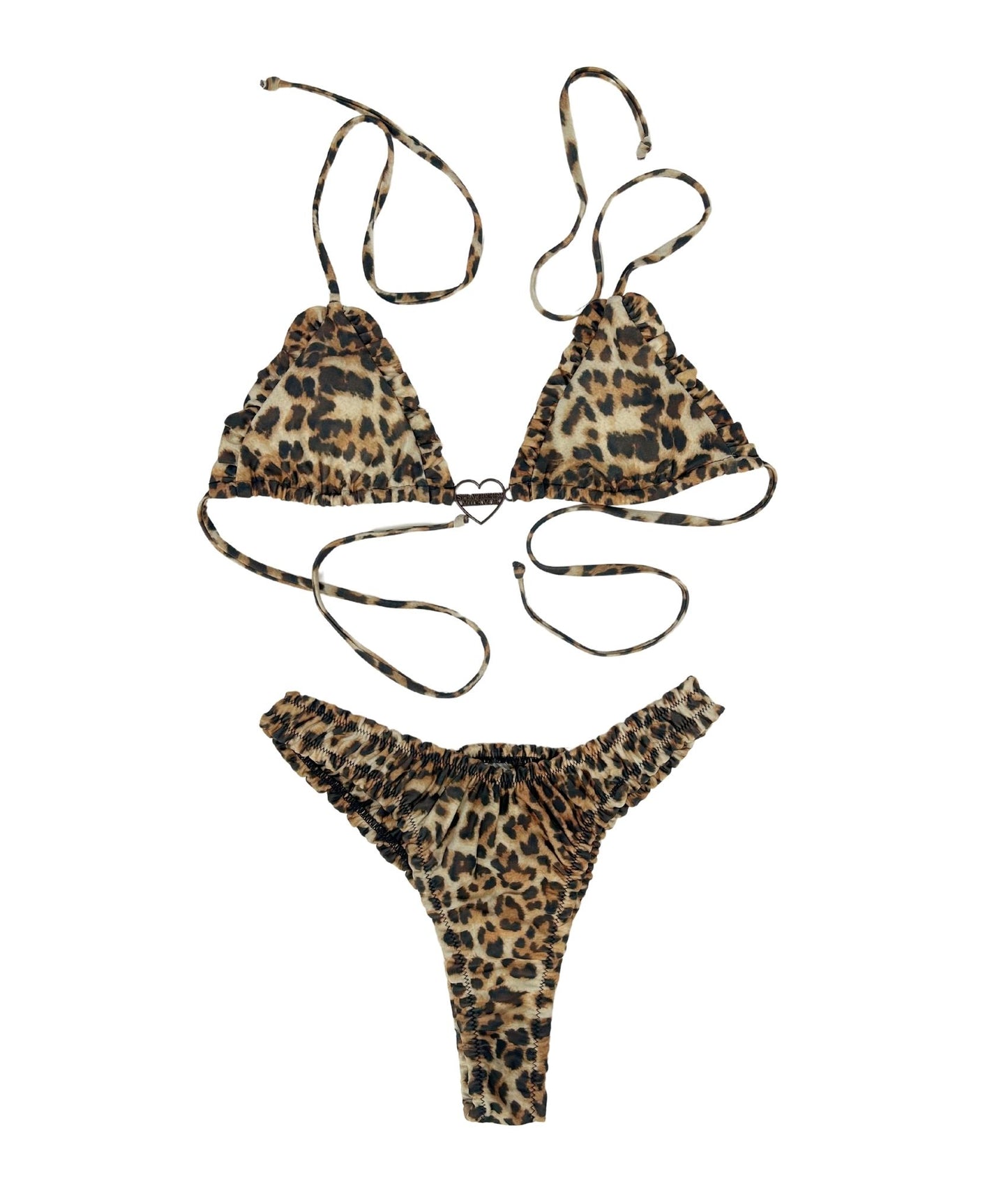 The Kit Kat Bikini, featuring a fierce bronze, brown, and black leopard print. The playful scrunchy design offers a flattering ruched look that hugs your curves perfectly. Accented with a charming heart-shaped logo, this bikini blends sweetness with boldness effortlessly. Ideal for those who love to stand out, the Kit Kat Bikini is both fun and stylish, making it a must-have for your summer adventures. Embrace your inner feline with this stunning piece!