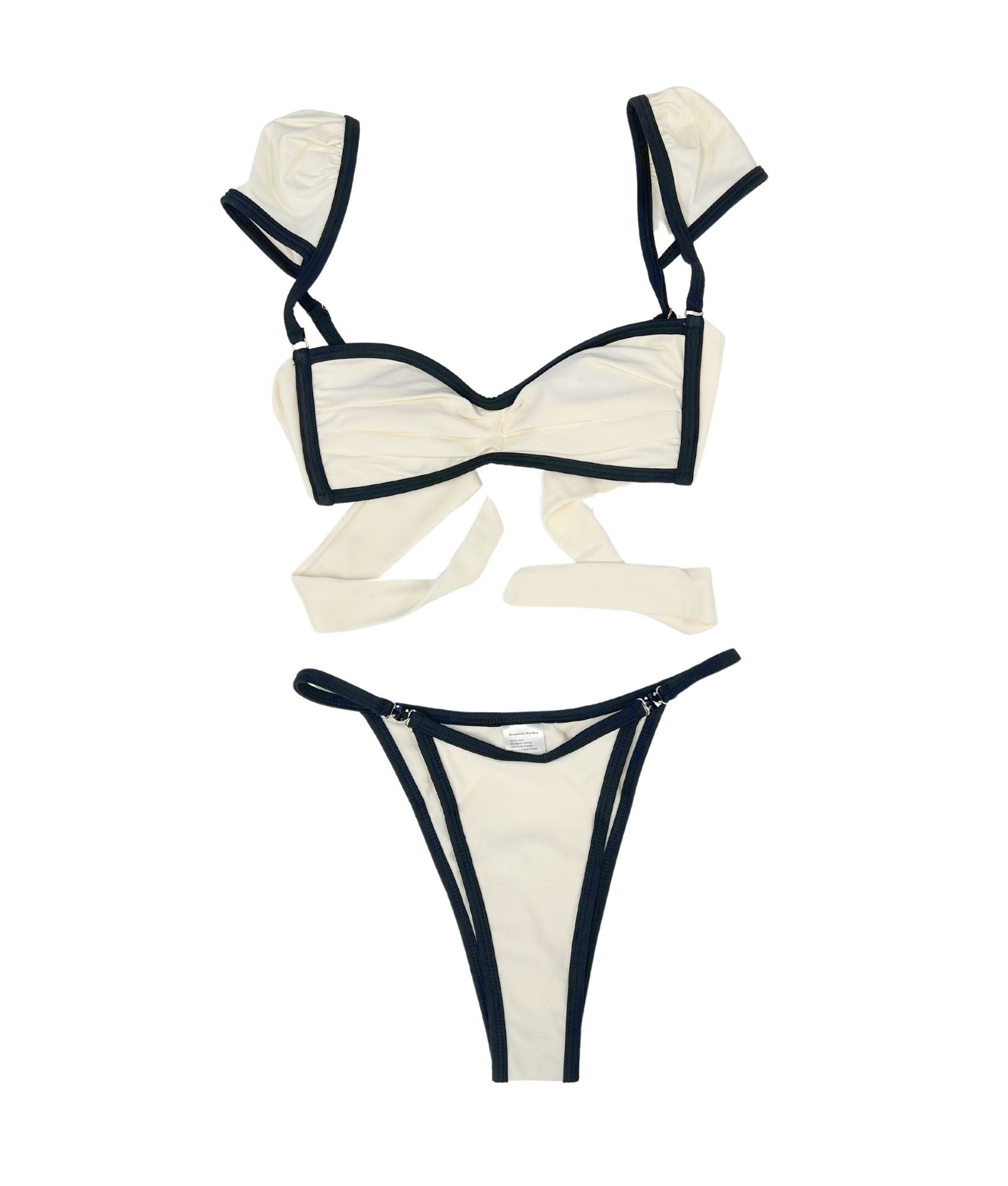 The Milos Bikini is a stunning blend of classic elegance and modern flair, featuring a monochrome palette of black and cream. This luxurious piece boasts sleek lines and exquisite black gem detailing, adding a touch of sophistication. Its design ensures a flattering fit that enhances your silhouette, making it perfect for any beach or poolside occasion. Elevate your swimwear collection with this timeless bikini that exudes confidence and style, effortlessly combining comfort with high-fashion appeal.