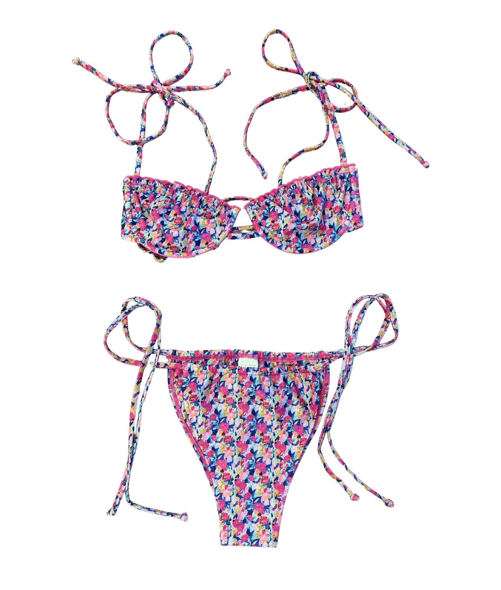 Introducing the Mars Bikini, a celestial beauty that combines gorgeous floral prints in shades of pink, purple, and blue. This bikini features a flattering fit with adjustable straps and charming ruffle detailing, making it perfect for any cosmic adventure. Its sweetness and cosmic charm will have you feeling like a celestial dream while enjoying the sun. Embrace your out-of-this-world style with this stunning piece that’s sure to turn heads!