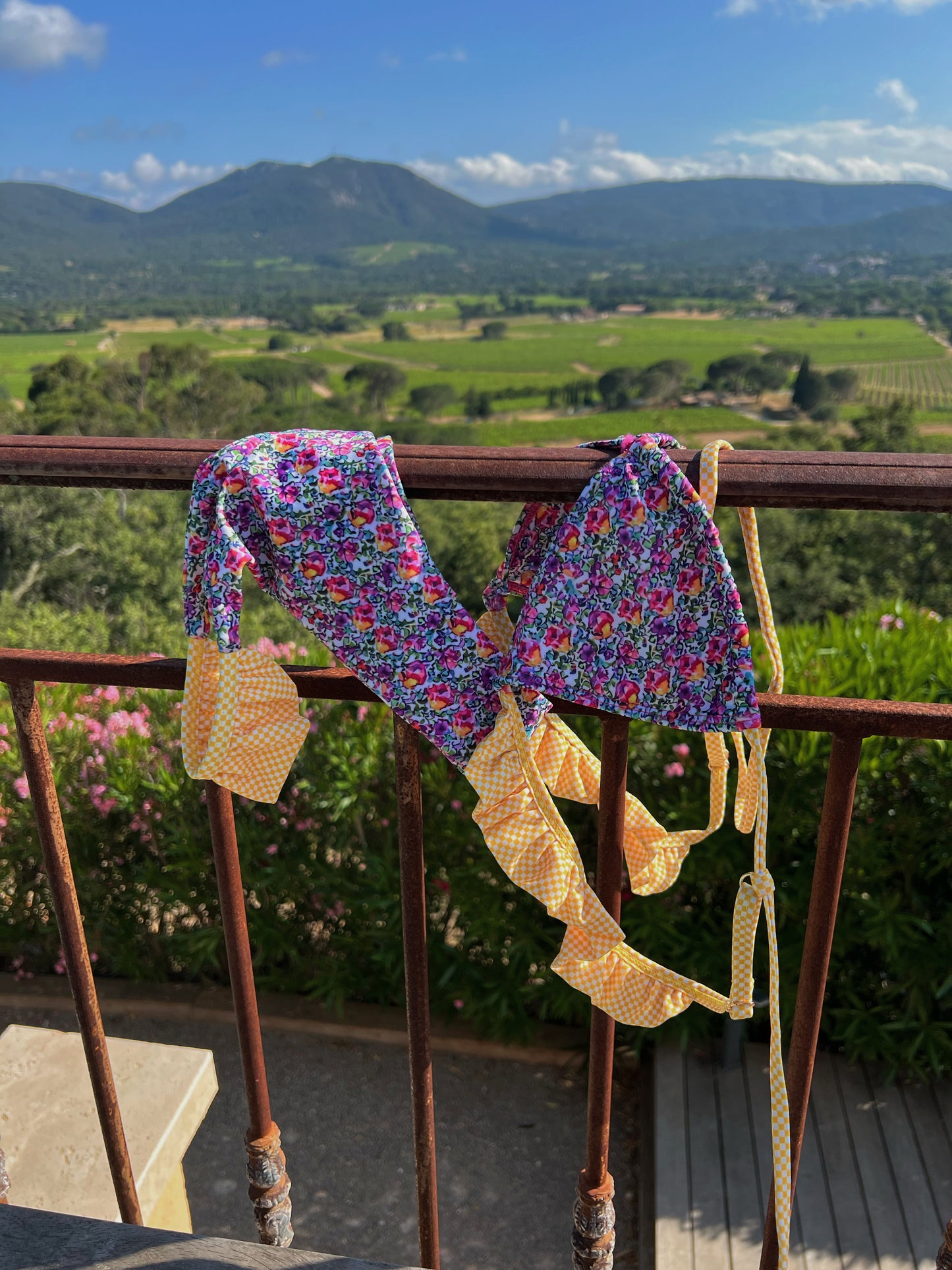 Dive into summer with the Marigold Bikini, adorned with dreamy pink and purple florals complemented by adorable yellow ruffle details. This playful and comfy design radiates flirty beach vibes, making it perfect for sun-soaked days. The stylish cut ensures a flattering fit, while the vibrant colors bring a cheerful touch to your swimwear collection. Whether you're lounging by the pool or enjoying a beach party, the Marigold Bikini is your go-to choice for fun and fashionable summer style!