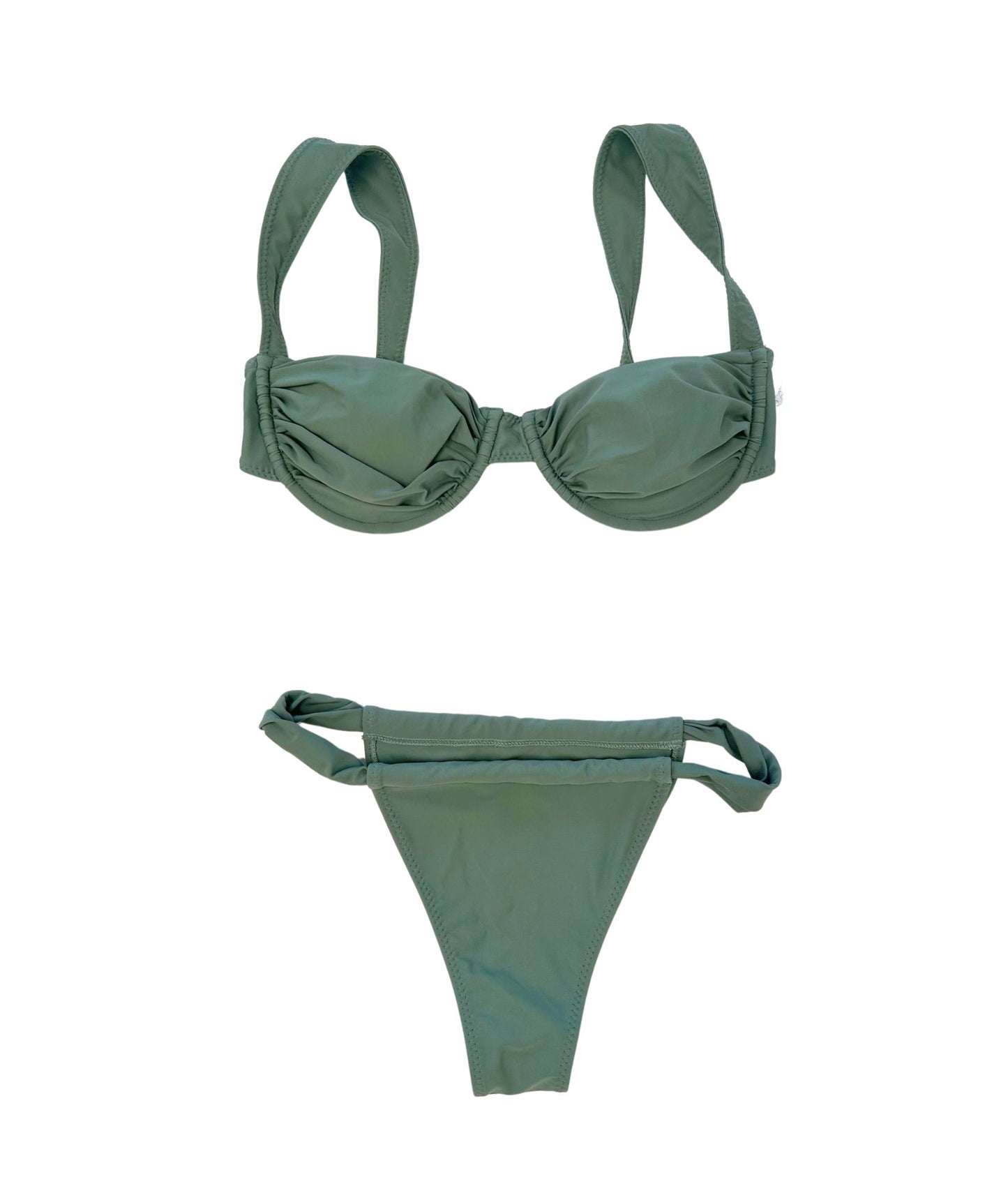 The Bronco Bikini, an elegant and earthy addition to your summer wardrobe. This chic bikini features a beautiful sage green hue that flatters every skin tone, making it a versatile choice for any beach day. Its stylish design ensures a comfortable fit while enhancing your natural curves. Perfect for lounging by the pool or soaking up the sun, The Bronco Bikini combines sophistication with effortless style, making it a must-have for your summer adventures!