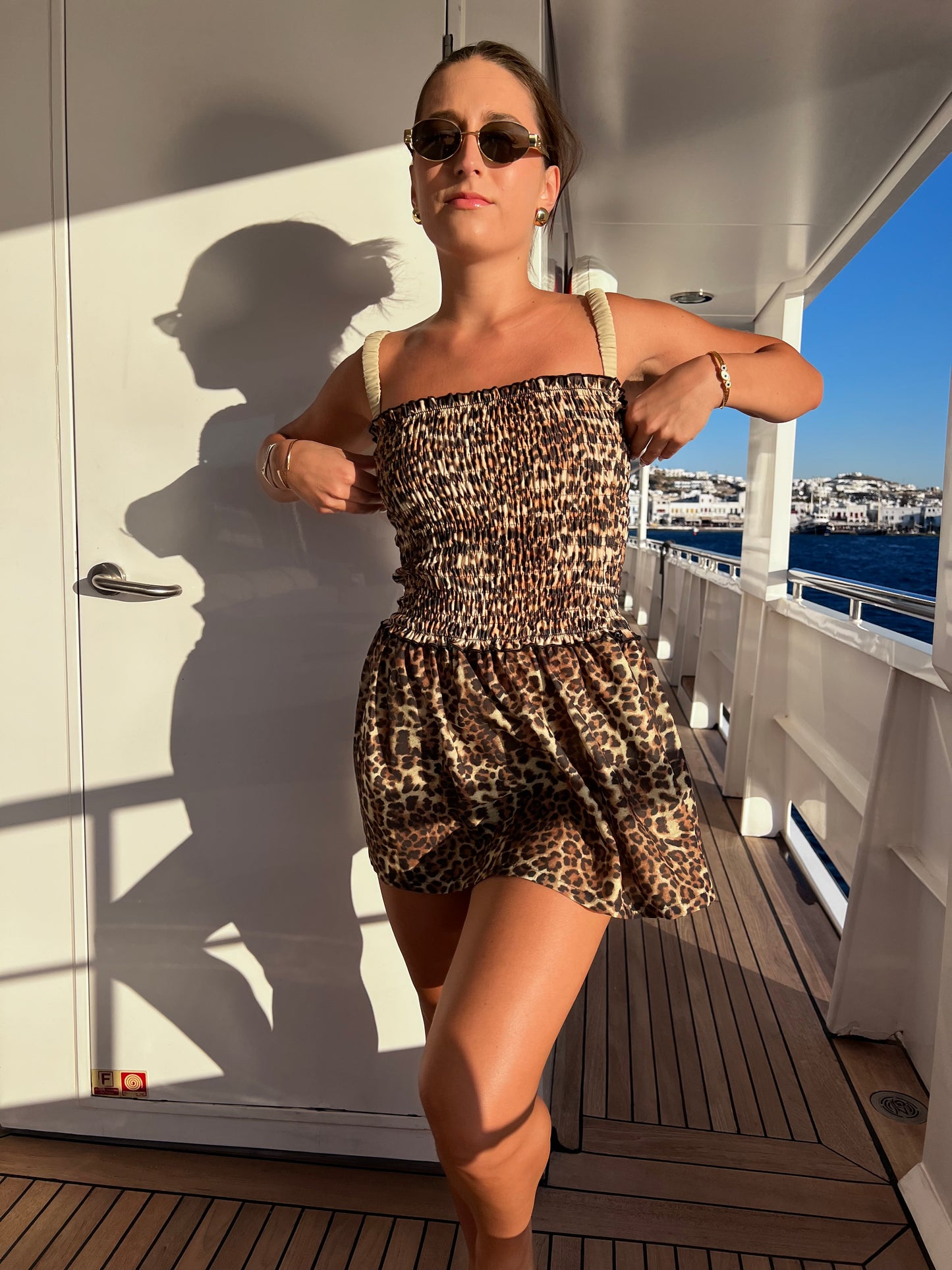 Unleash your playful side with the Kit Kat Scrunch Dress, a fierce yet flirty leopard print mini dress that’s perfect for any occasion. This versatile piece features a comfortable stretch fit and a breezy flared skirt, making it an ideal cover-up or a standout statement dress. Whether you're at the beach or out for brunch, this wardrobe staple combines style and comfort effortlessly. Embrace your wild side and make every moment memorable in this fabulous dress!